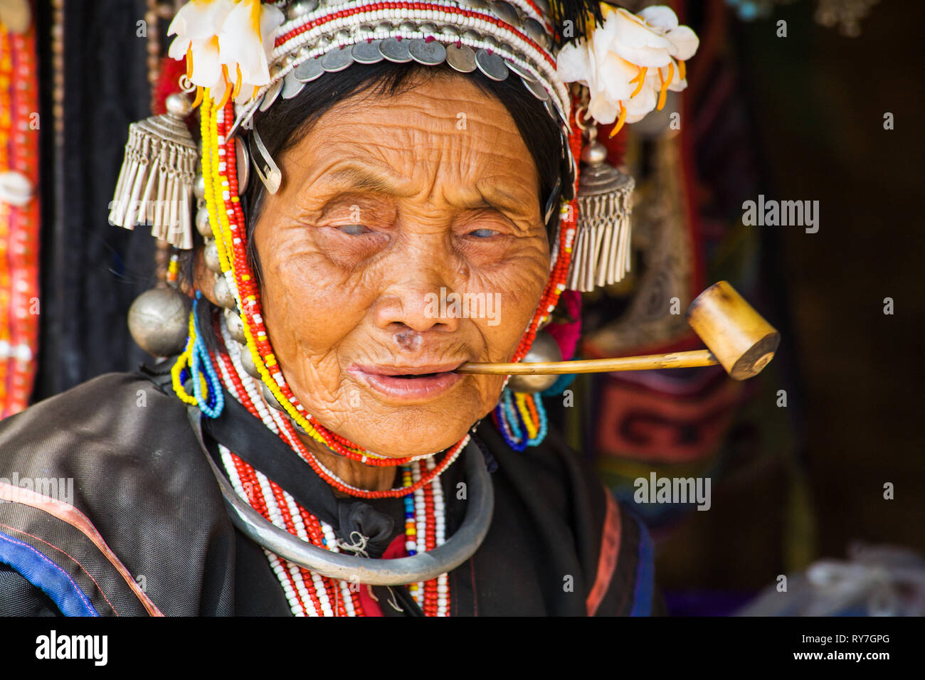 Old Akha woman, Chiang Mai Province, Thailand. The Akha are among the most impoverished of the hill tribes. They are, however, the most fascinating an Stock Photo