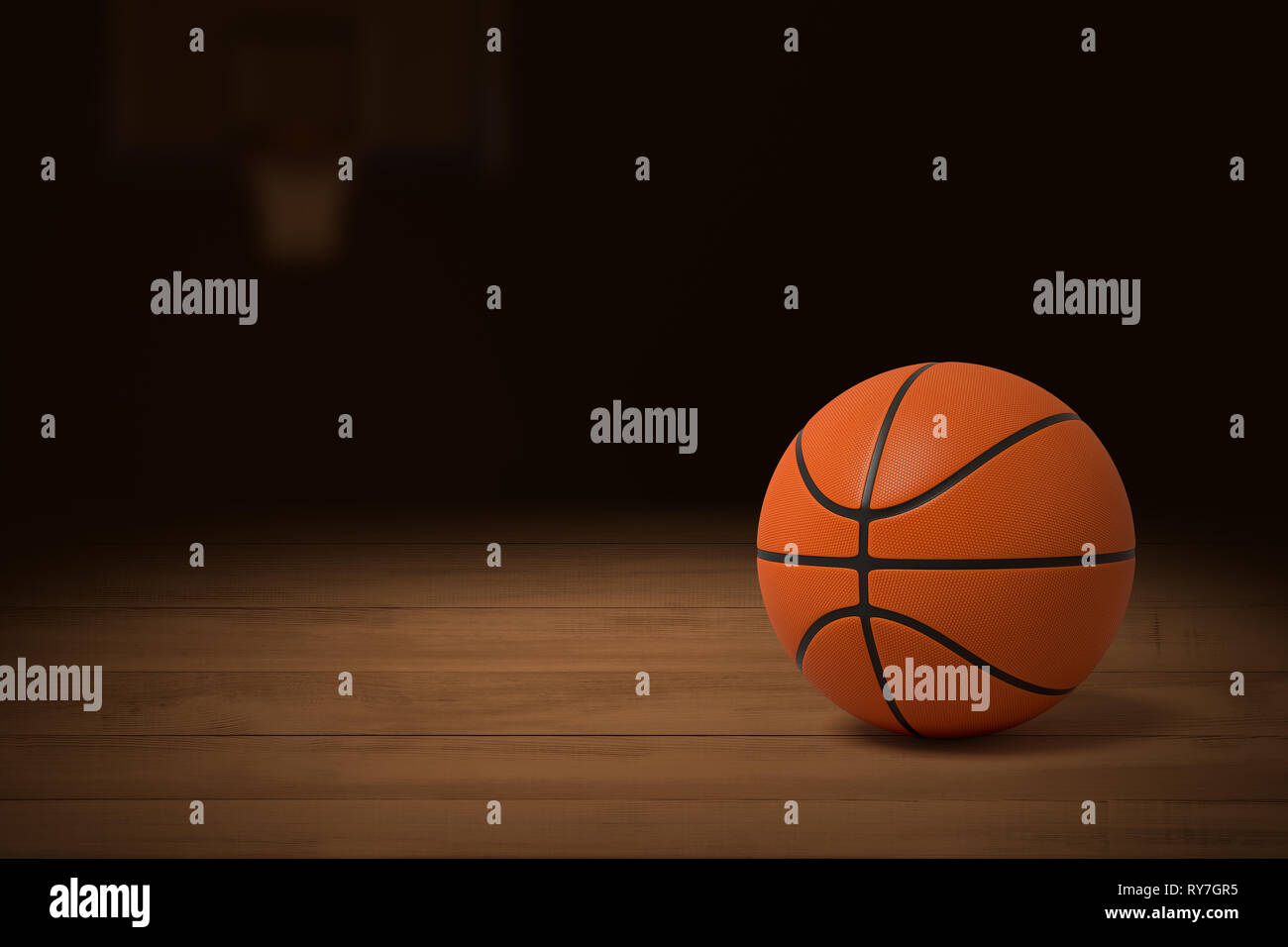 3d rendering of a basketball on the wooden floor of a dimly lit gym. Stock Photo