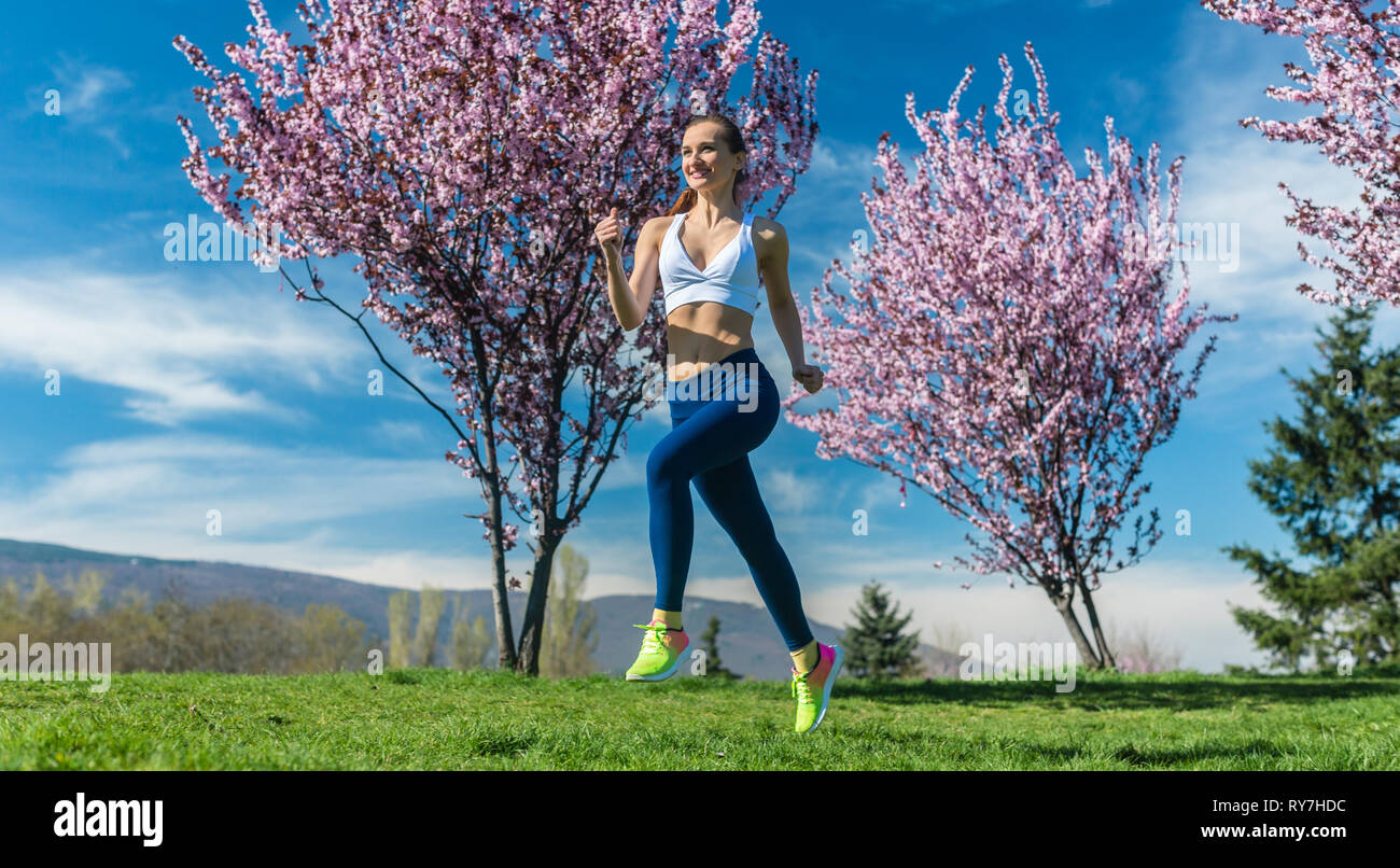 Spring Running Woman Woman running for fitness on a spring day Stock Photo - Alamy