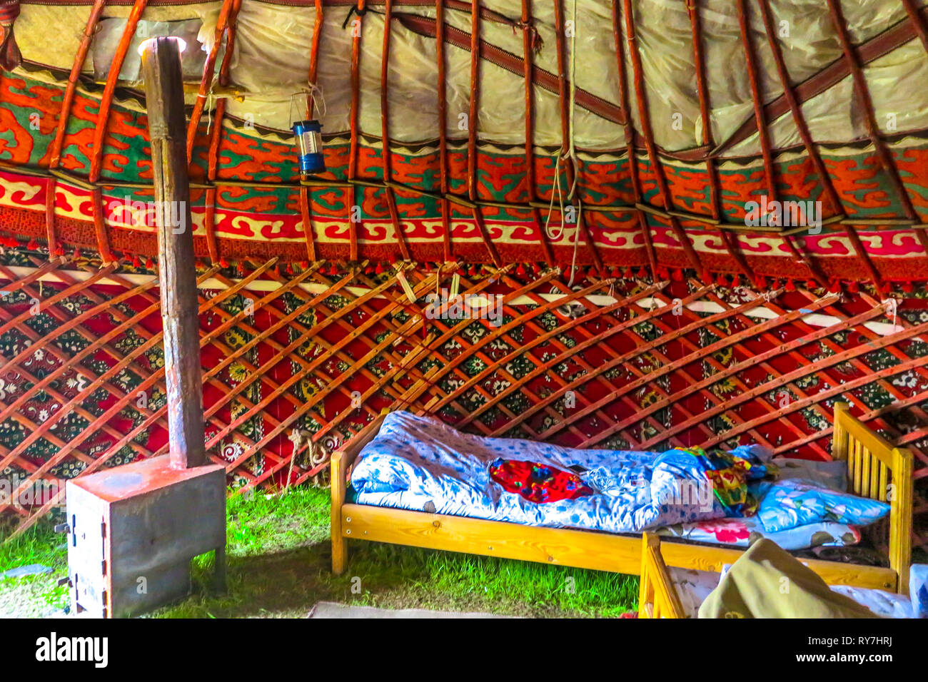 Tash Rabat Caravanserai Traditional Kyrgyz Yurt Interior with Stove and Sleeping Bed Stock Photo