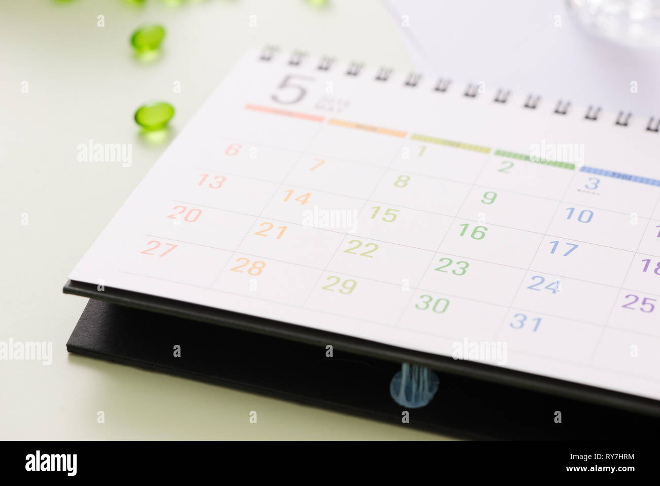 Medical pills capsule in pill box with calendar on white background