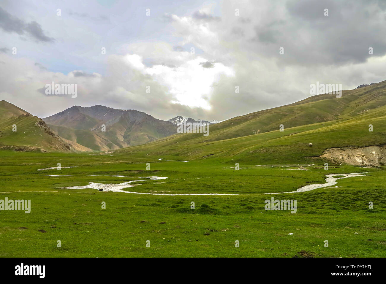 Tash Rabat Caravanserai Landscape with Snow Capped At Bashy Too Mountain Range and River Stock Photo