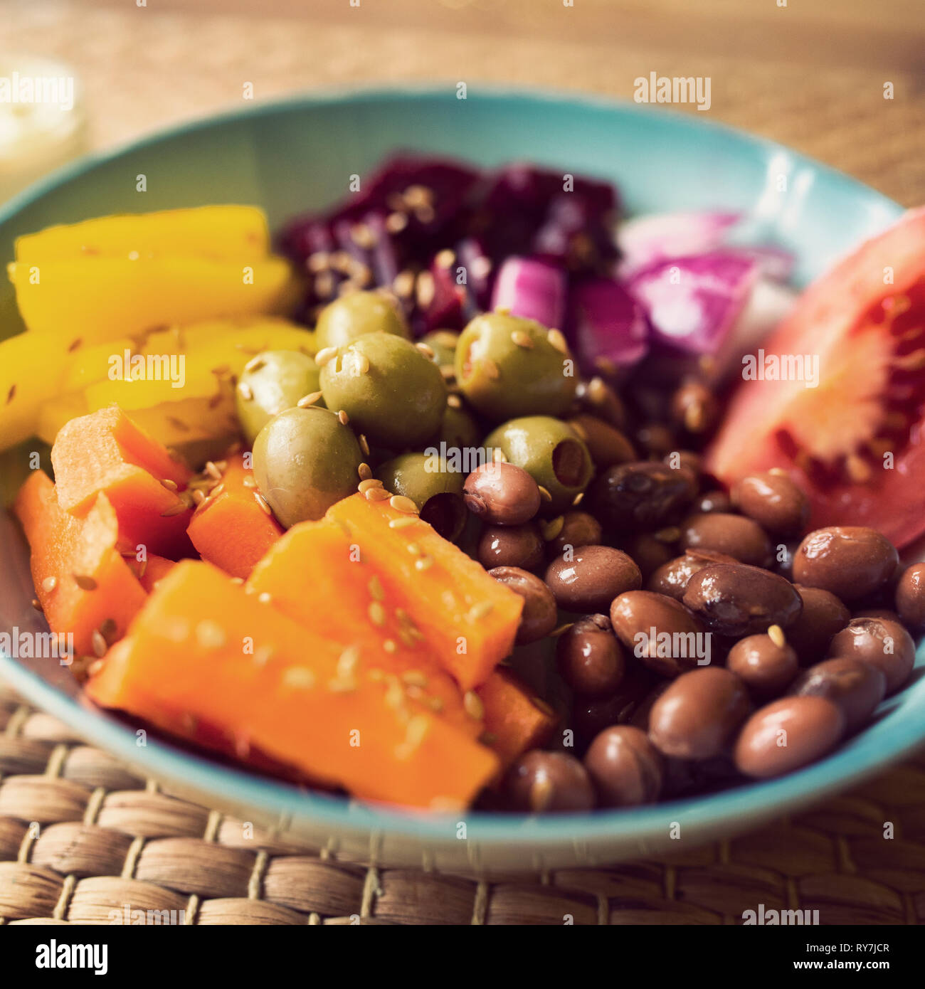 vibrant vegan buddha bowl with instagram vsco style filter. Veganuary Stock Photo