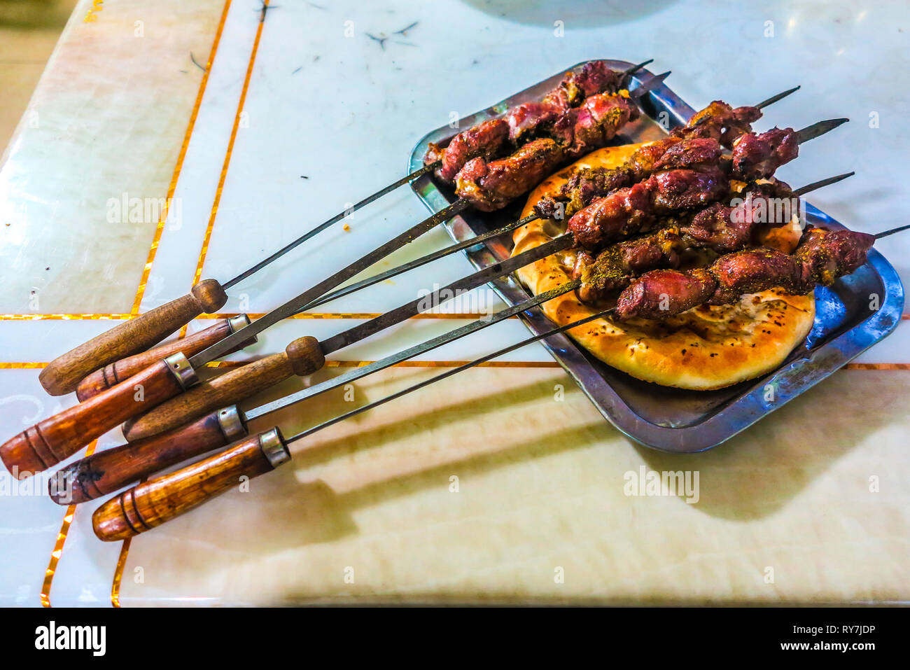 Uyghur Traditional Hot Spicy Lamb Skewers with Cumin and Naan Bread