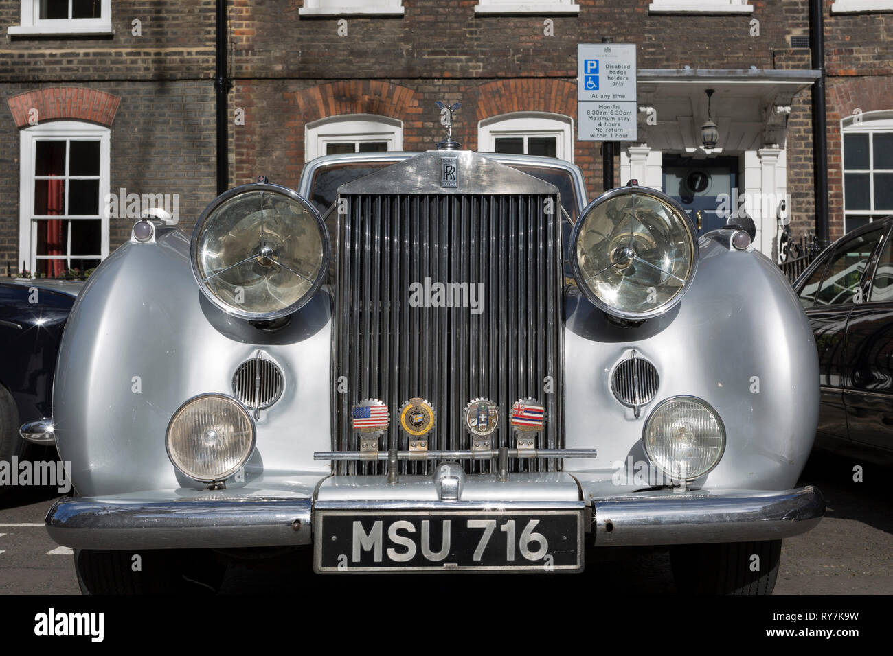 A 1954 Rolls-Royce Silver Dawn is parked in Smith Square, a small square behind the Houses of Parliament, before collecting its VIP passengers - barristers who are being sworn in as QCs (aka Silks in legal vernacular), on 11th March 2019, in London, England. Stock Photo