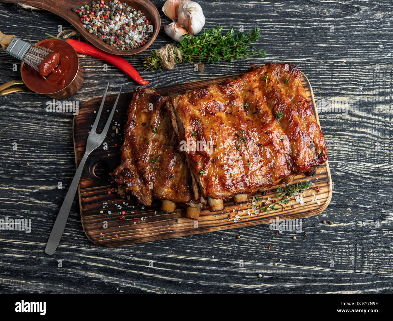 grilled pork ribs with sauce on a cutting board , spice, marinade Stock Photo