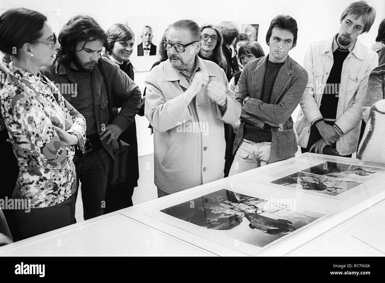 Professor Otto Steinert (middle) at a photography exhibition  with portraits he made, picture taken 1976. Professor Otto Steinert (born 12. July 1915, death 3. March 1978) was one of the most important teachers of modern photography and photojournalism and taught from 1959 until his death at the Folkwang School of Design in Essen, Germany. Stock Photo