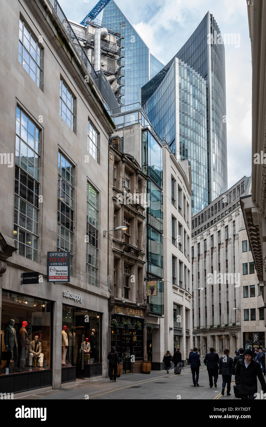 The Lloyds of London building, "Scalpel", and Wllis Building loom over far end of Lime Street in the City of London Stock Photo