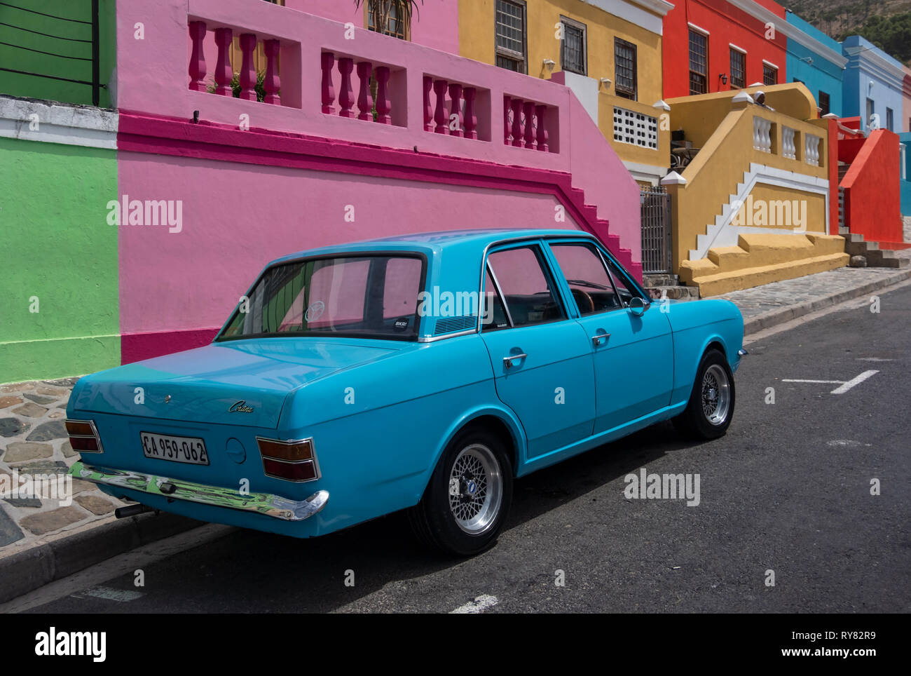 Old Blue Ford Cortina Car in front of Multi Coloured Houses of Bo Kaap, Cape Town, Western Cape, South Africa Stock Photo