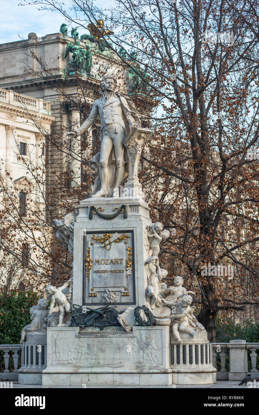Mozart statue at Neue Burg building part of the Hofburg palace complex seen from Burggarten. Vienna, Austria. Stock Photo