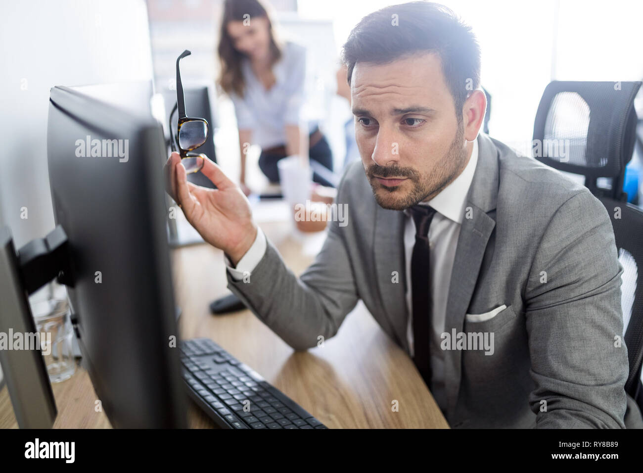 Group of unsuccessful business people and badly managed company leads to unhappiness Stock Photo