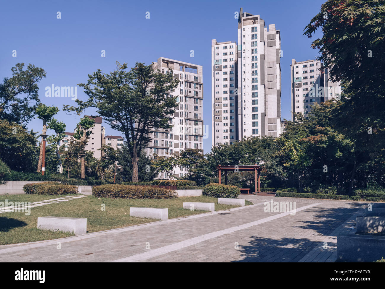 small park in front of resedential apartments in Seoul on sunny september day Stock Photo