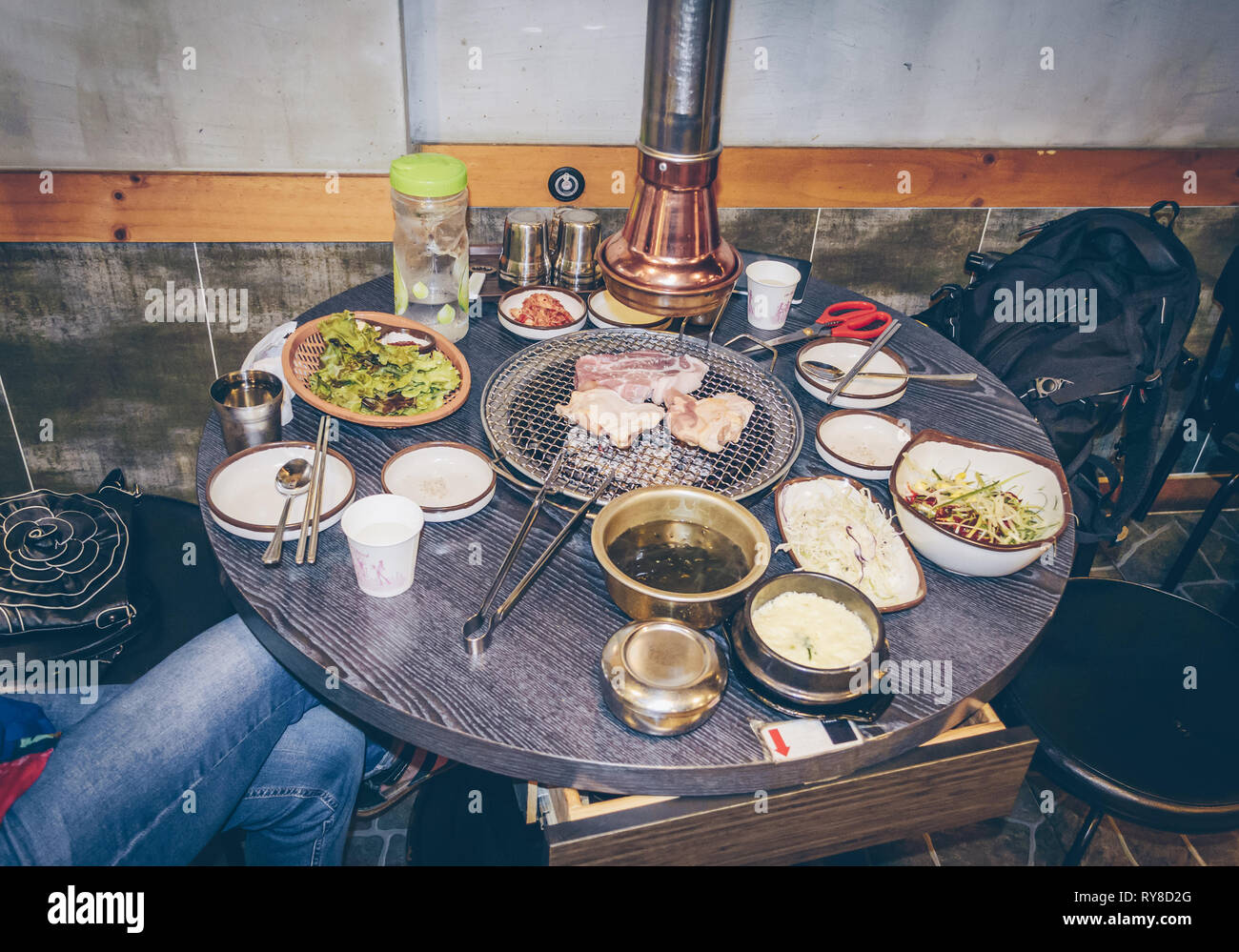 Korean Barbecue (BBQ) Table with Grill and Sides Stock Photo - Alamy