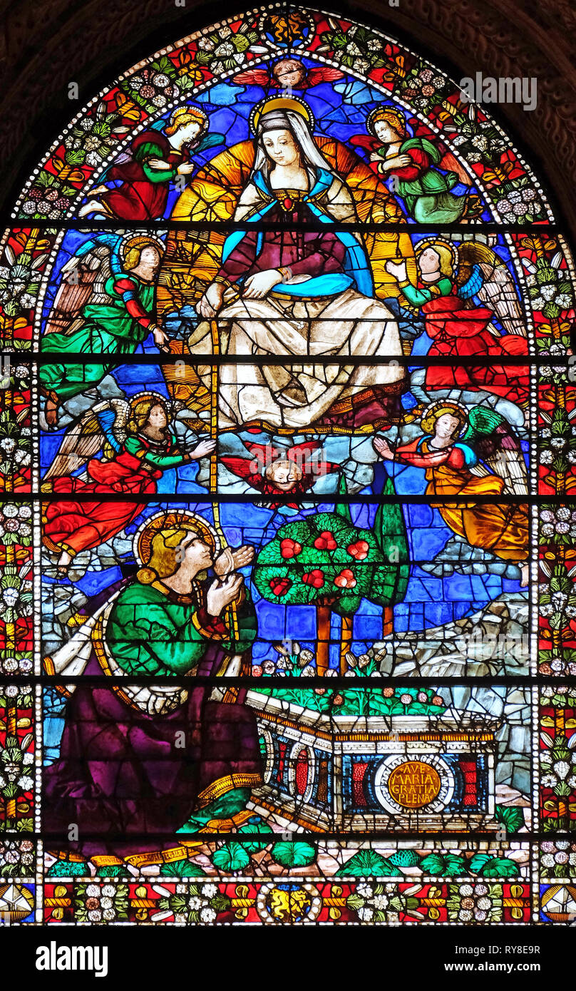 Madonna giving her girdle to Saint Thomas, stained glass window in Santa Maria Novella Principal Dominican church in Florence, Italy Stock Photo