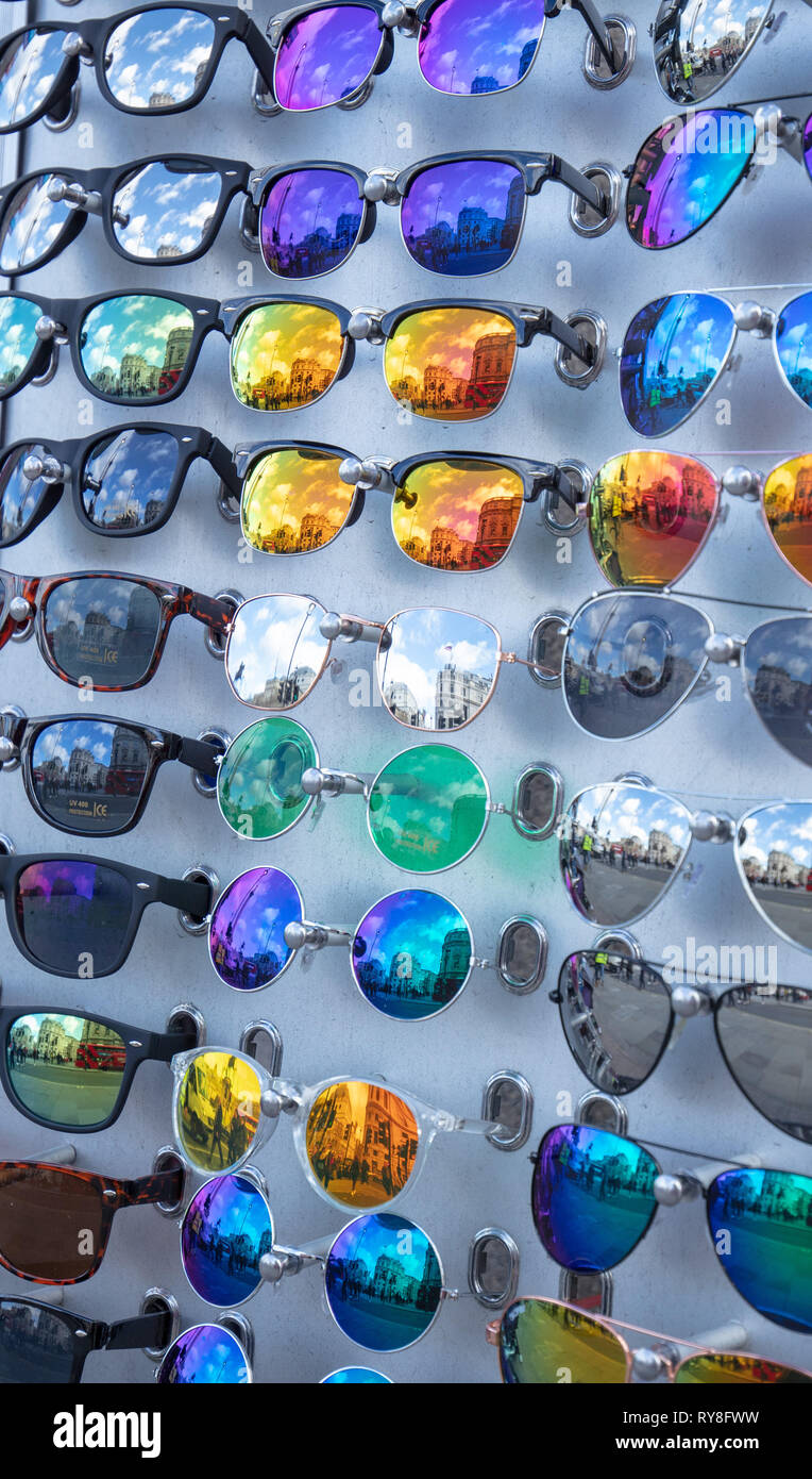 A group of colourful and reflecting cheap sunglasses for sale in a small  tourist shop near Trafalgar Square, London, UK Stock Photo - Alamy