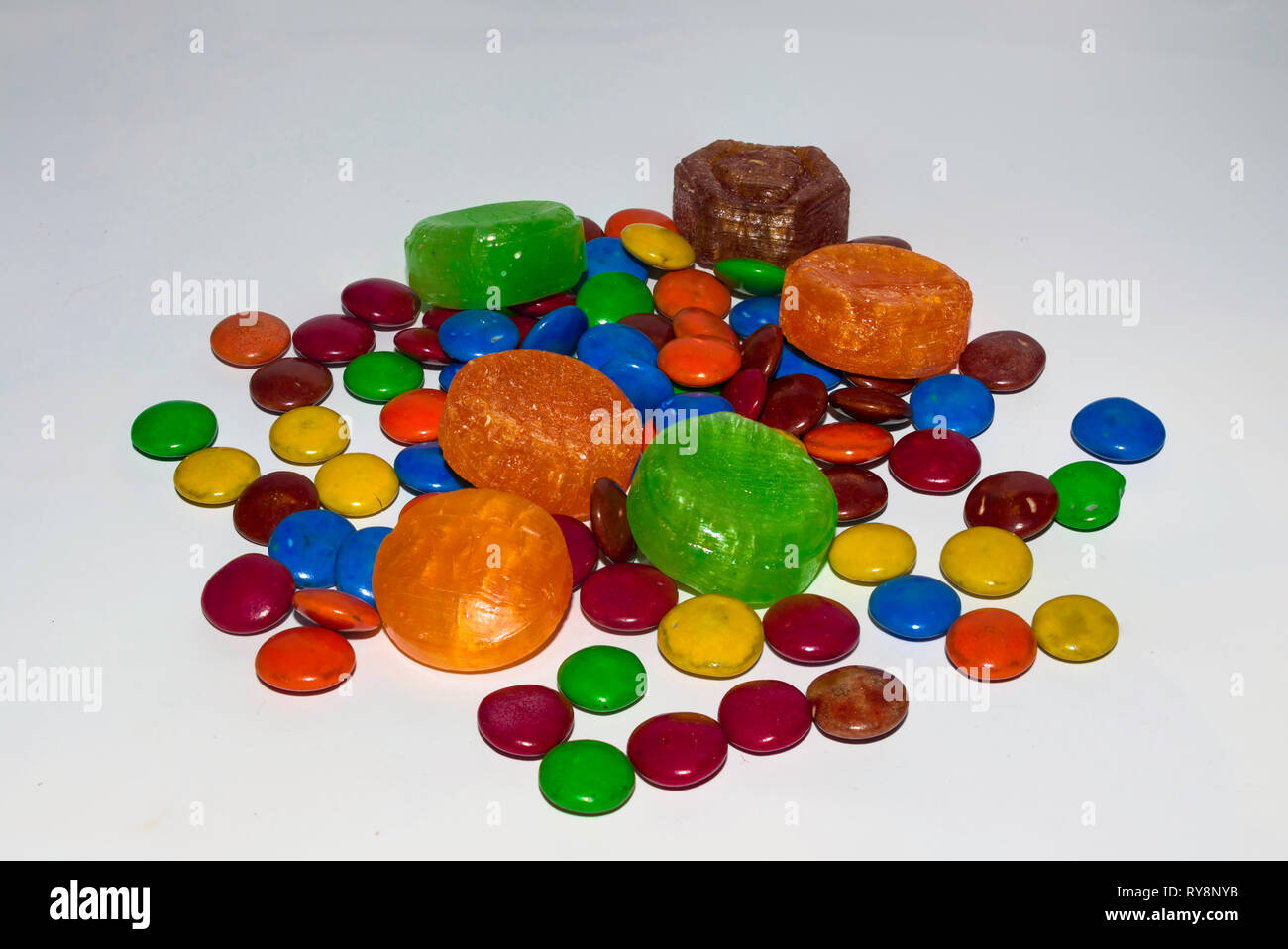 colorful coated chocolate candies on a white background. Stock Photo