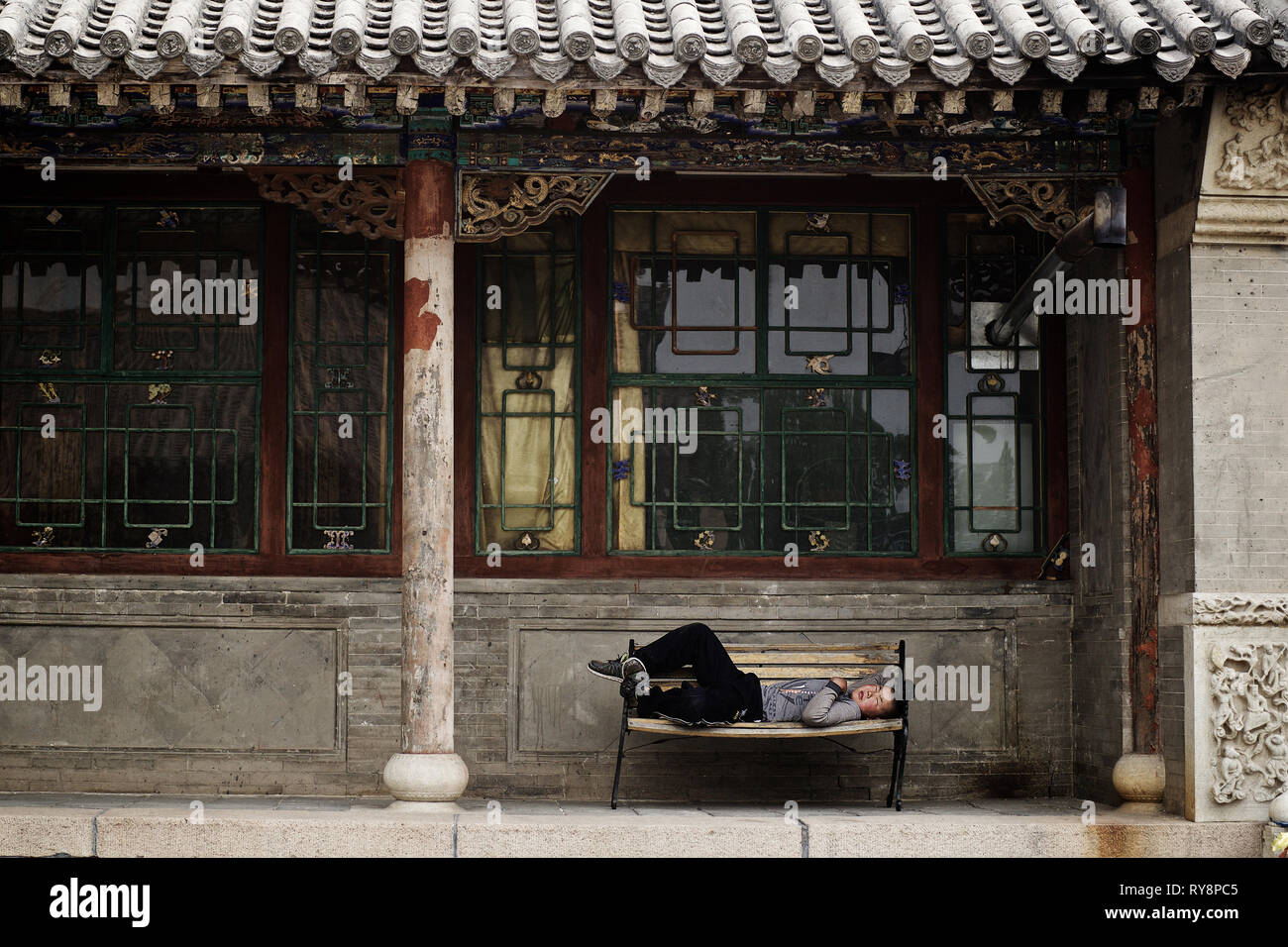 Little chinese monk sleeping in buddhist temple, Wutai Shan, Shanxi, China Stock Photo