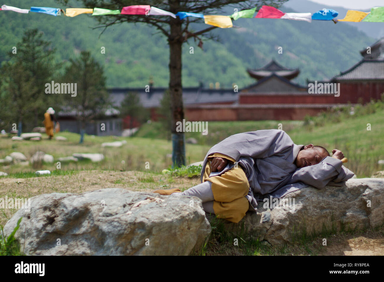 Chinese monk sleeping in in buddhist temple, temple garden, Wutai Shan, Shanxi, China Stock Photo