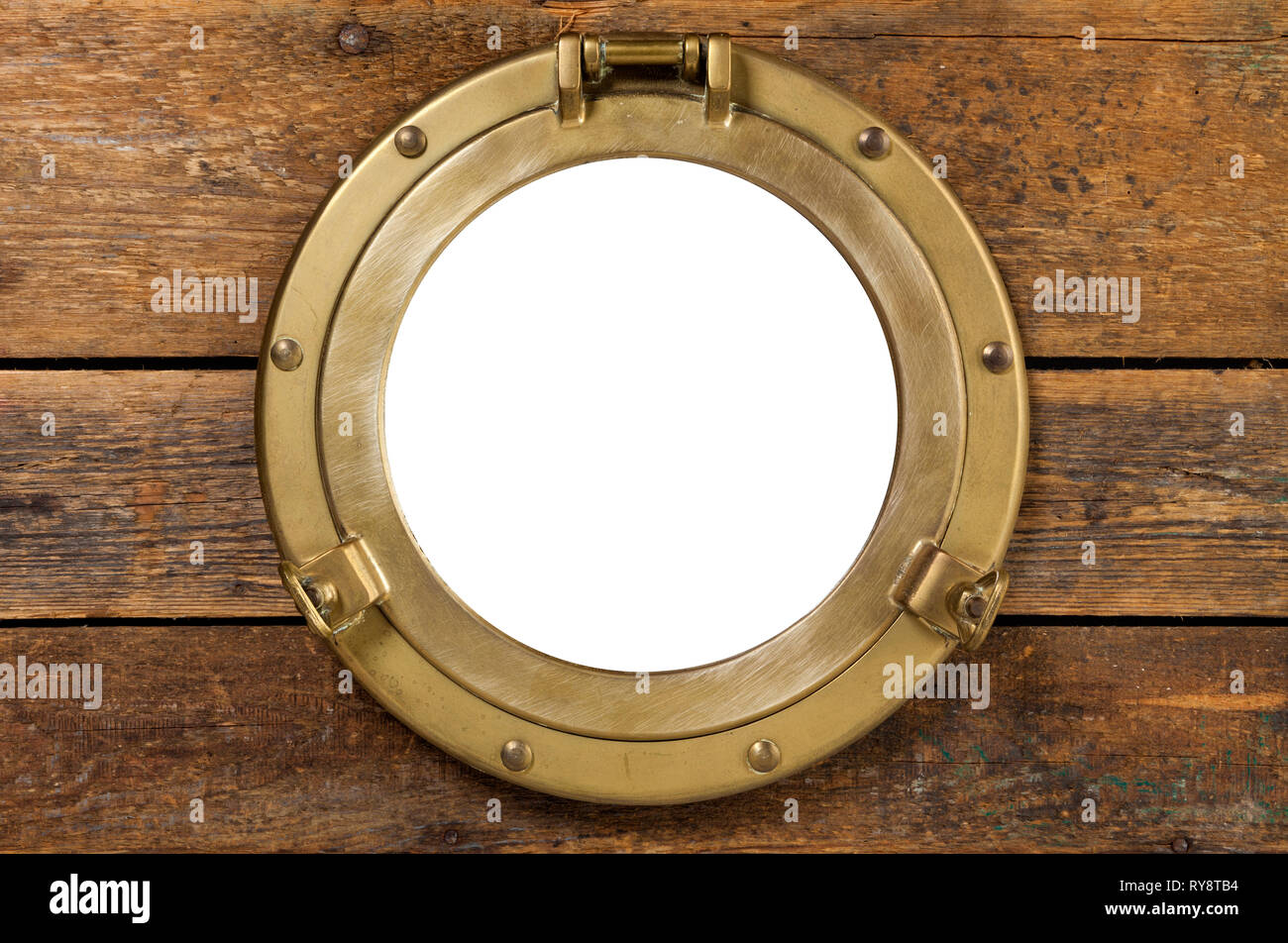old brass porthole in wooden wall, window isolated with clipping path