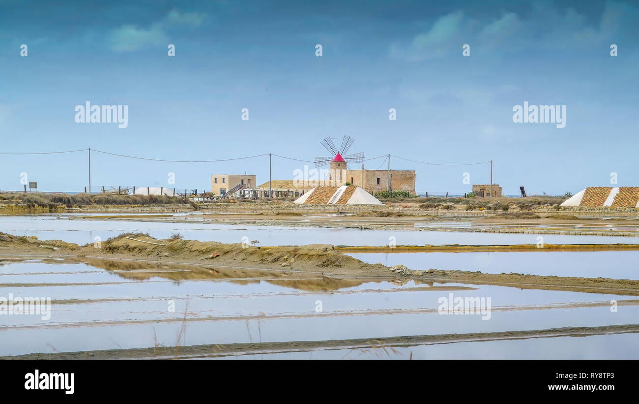 Landscape view of the water fields on the side of the saltmine area of Trapani in Sicily in the small village  in Italy Stock Photo