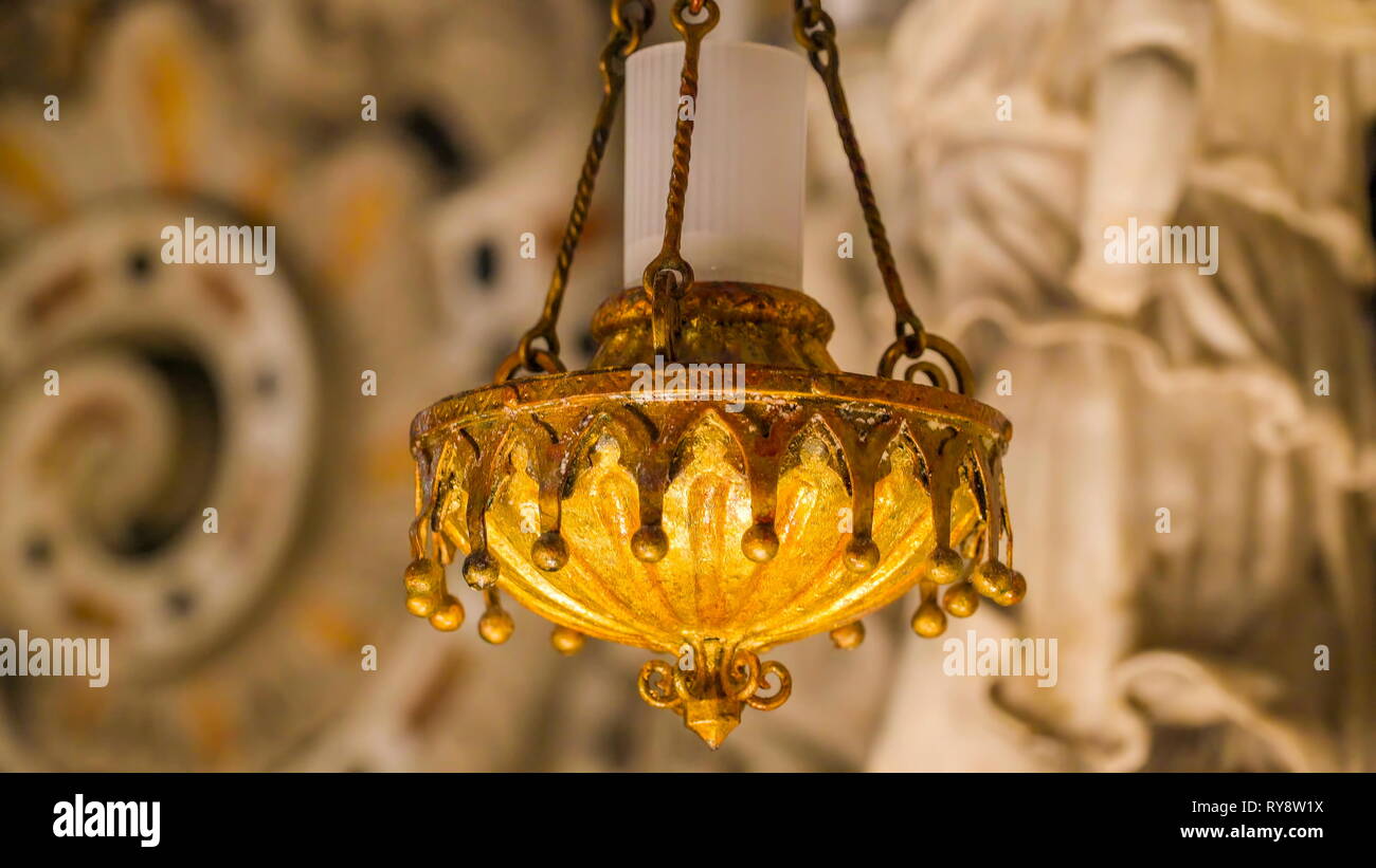 The yellow candle holder inside the cathedral in Palermo Sicily