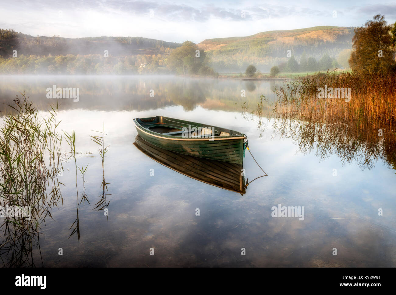 A rowing boat moored by the banks of Loch Ard Stock Photo - Alamy