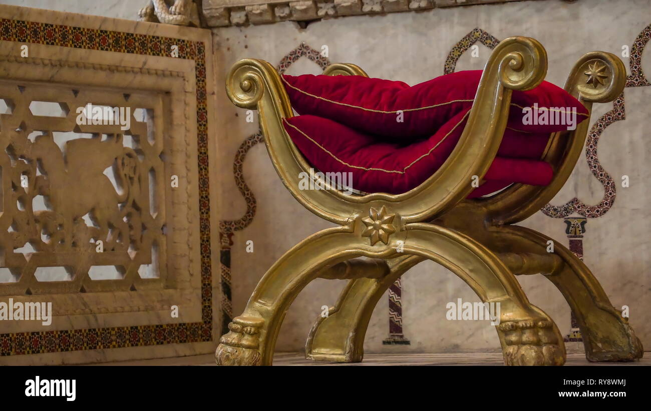 A Small Golden Chair On The Altar Of The Cathedral In
