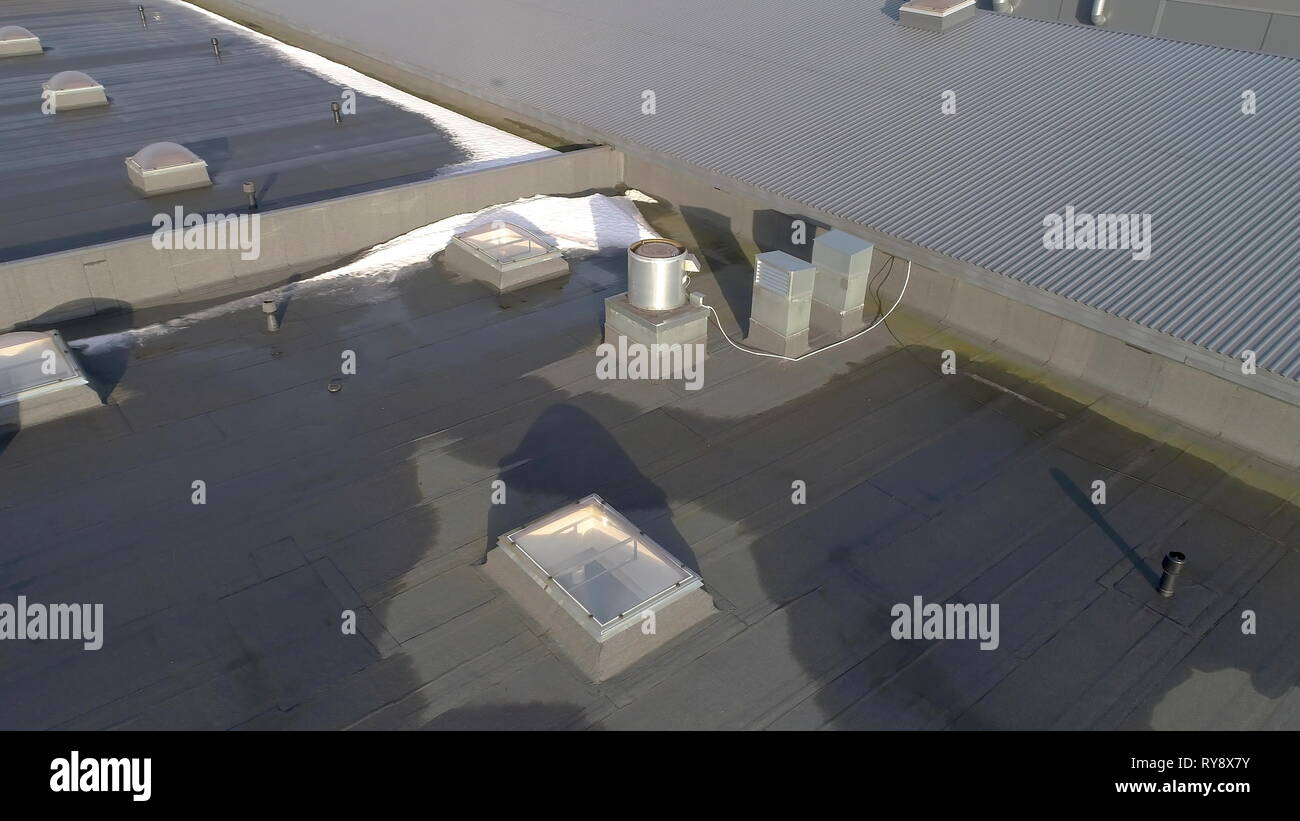 A look of the tin roof element of the building with the exhaust pipe on