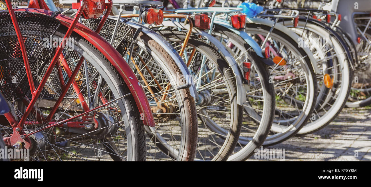 Old bikes on a bicycle parking lot. Stock Photo