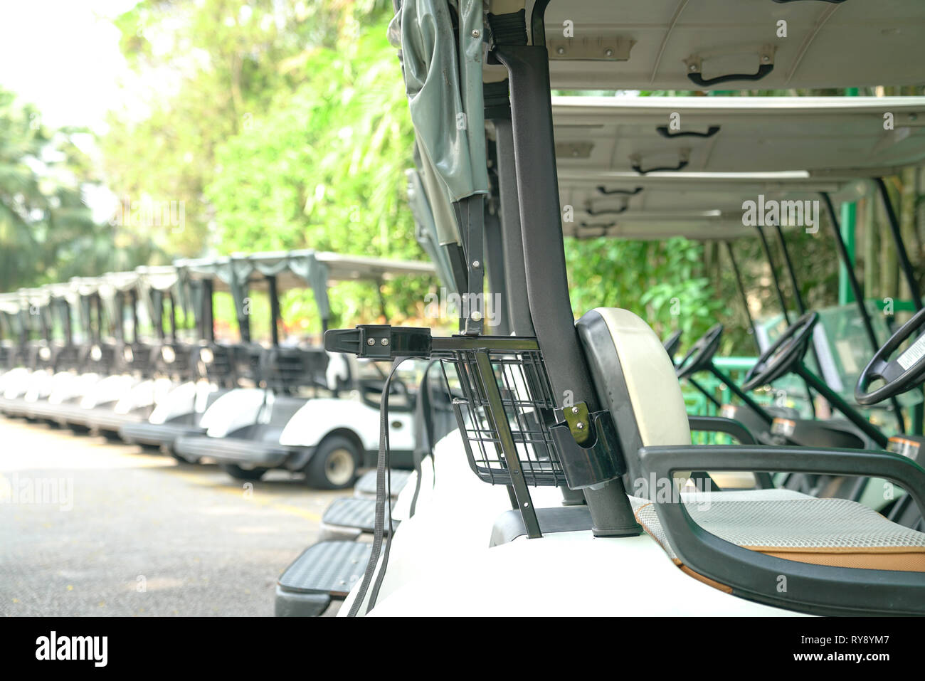 Recreation or transport concept Golf carts parked outside a golf club