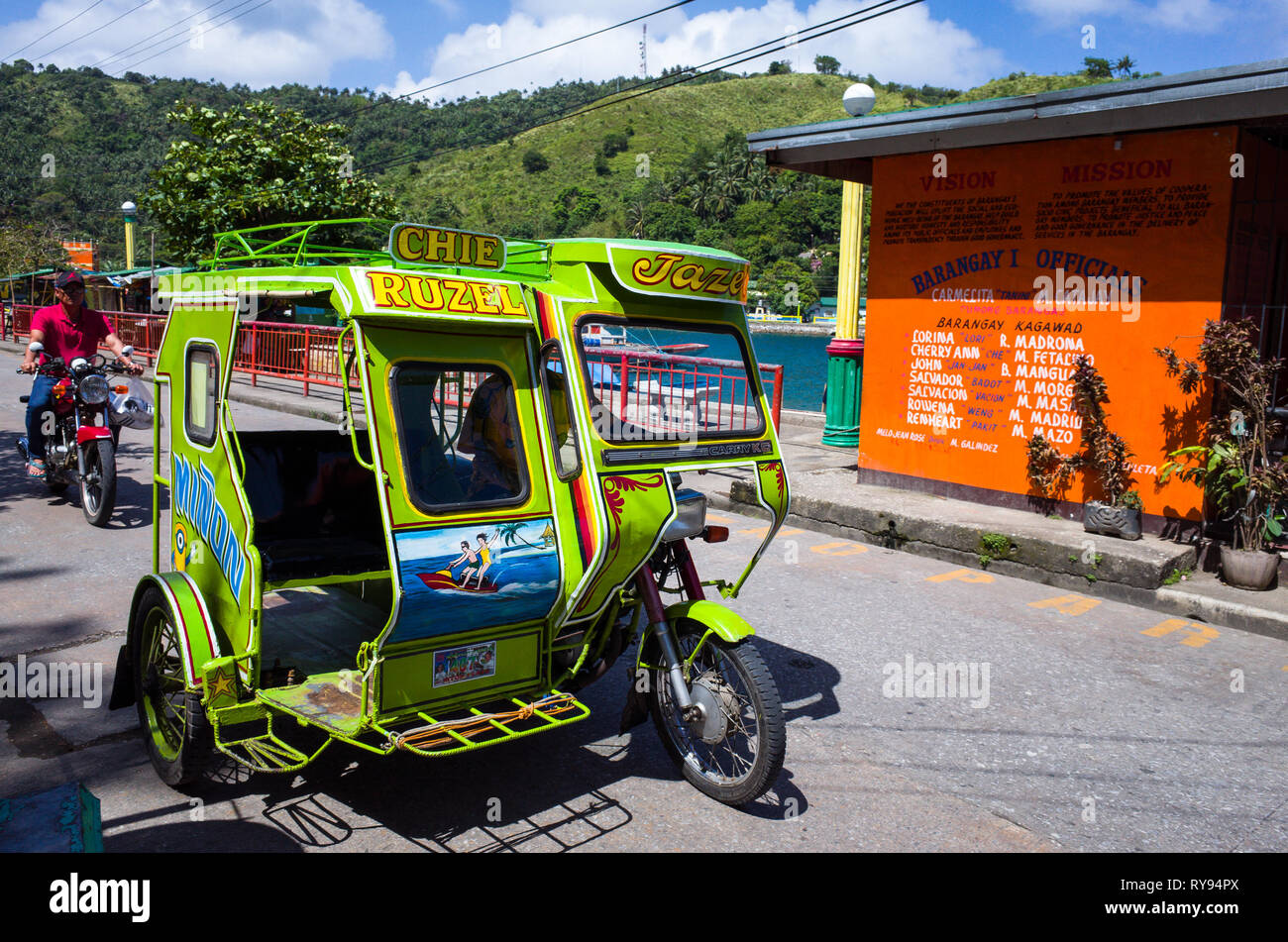 Colorful Tricycle Taxi, a motorbike with sidecar that's an iconic part of Filipino Culture - Romblon Island, Philippines Stock Photo