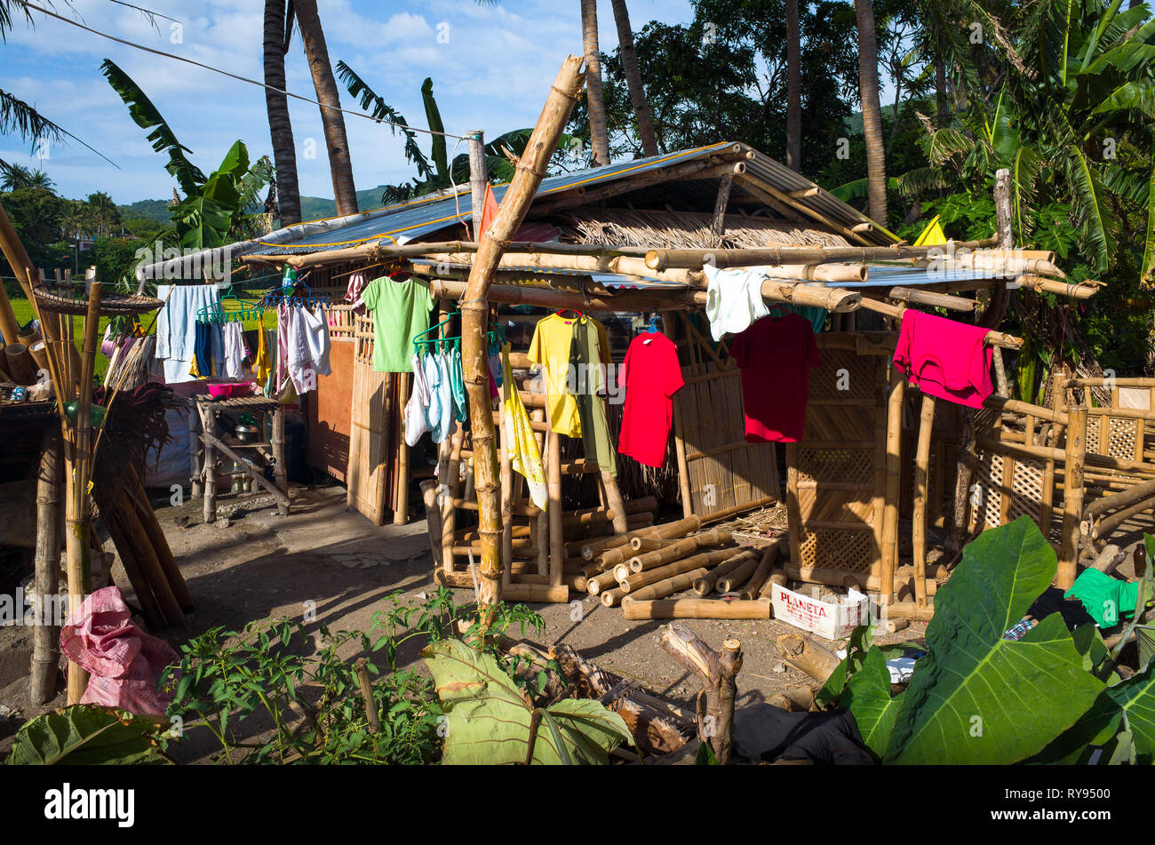 Colorful clothes hanging on native bamboo house Romblon Island, Philippines Stock Photo