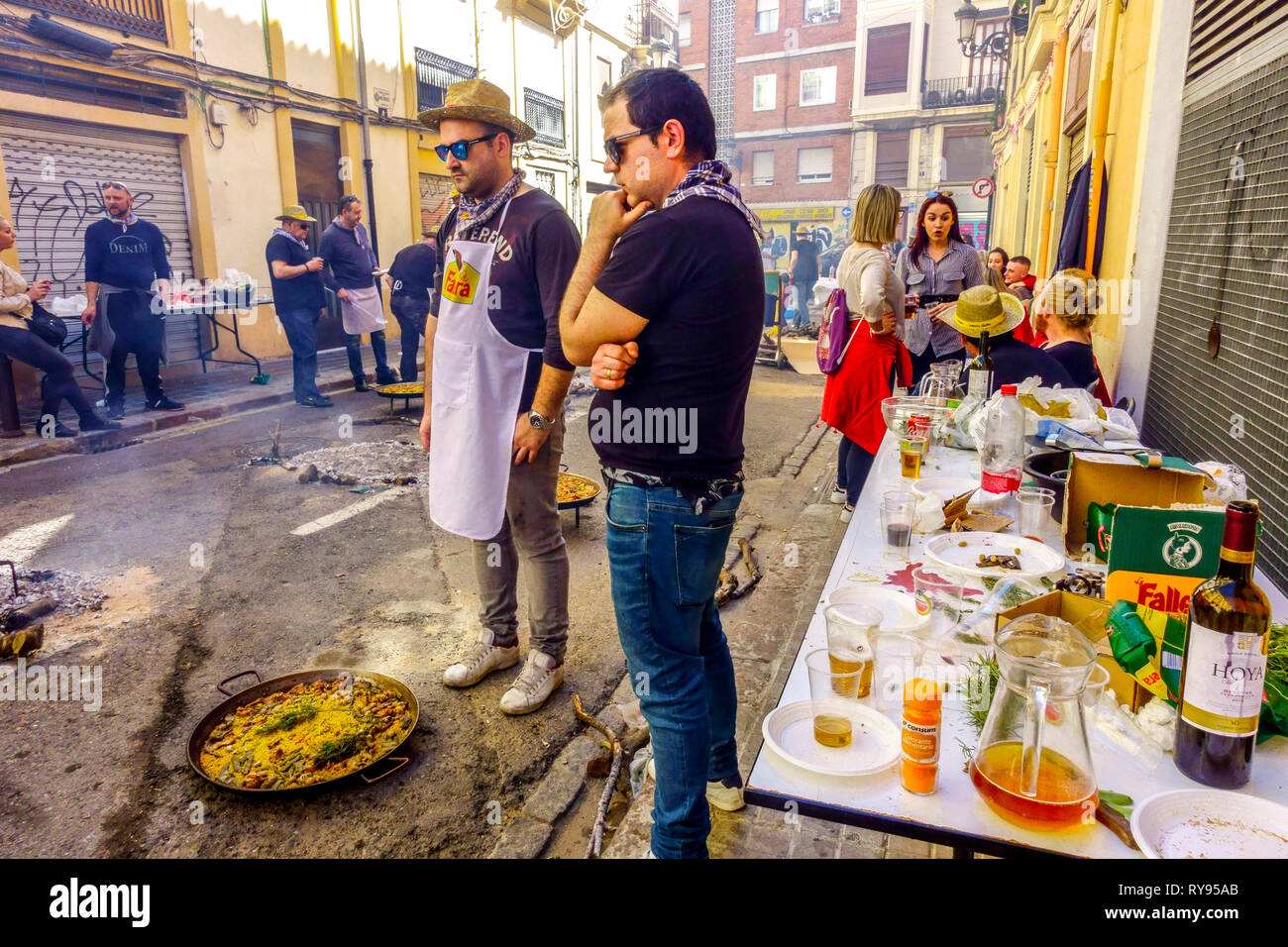Street Fallas party Spain Valencia eating table in Barrio El Botanico Stock Photo