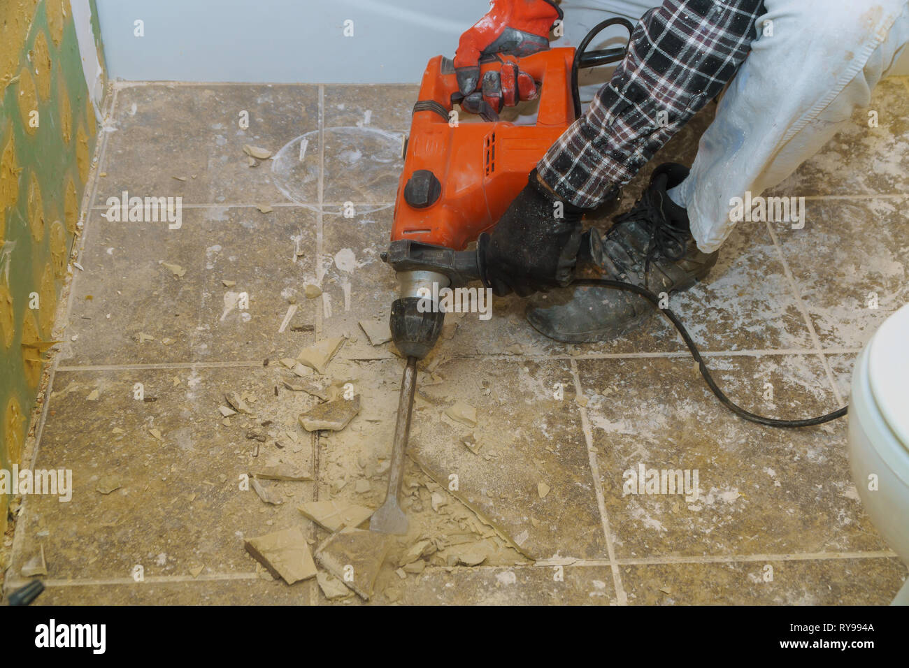 Worker Demolish Old Tiles Remove In A Bathroom With Hammer Stock Photo Alamy