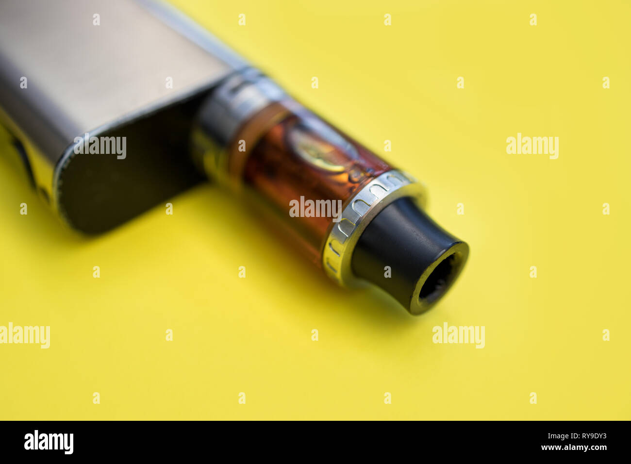 Vape Pen Metal Electronic Cigarette With Vaping Yellow Background Stock Photo Alamy
