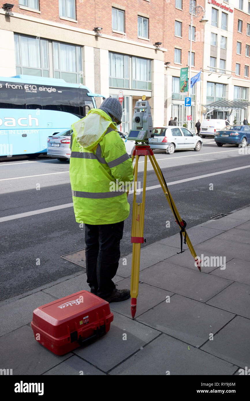 Surveyor with leica theodolite Dublin Republic of Ireland Europe Stock Photo