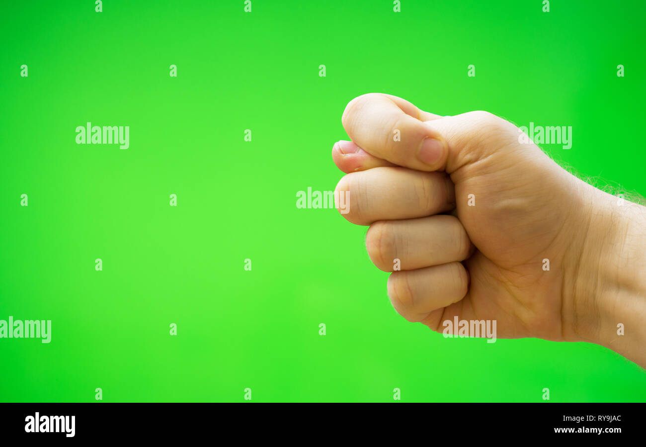 Male hand shows fig sign. Chroma key. Place for your advertisement. Stock Photo