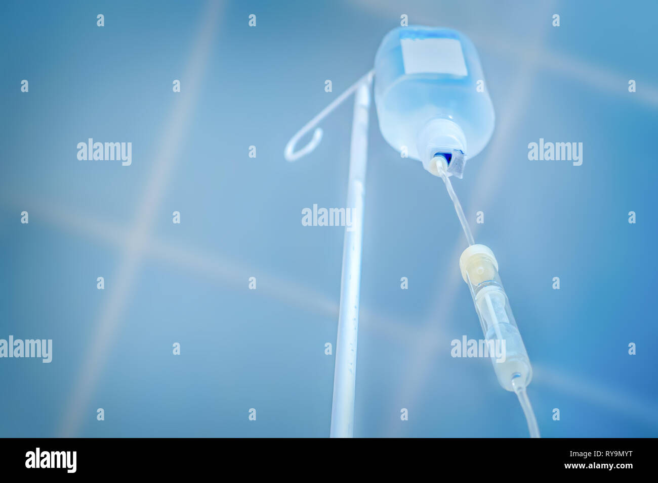 Private medicine. Anesthesia. Traditional medicine. Infusion drip, drop counter in hospital background. Preparing for surgery. Painless concept Stock Photo