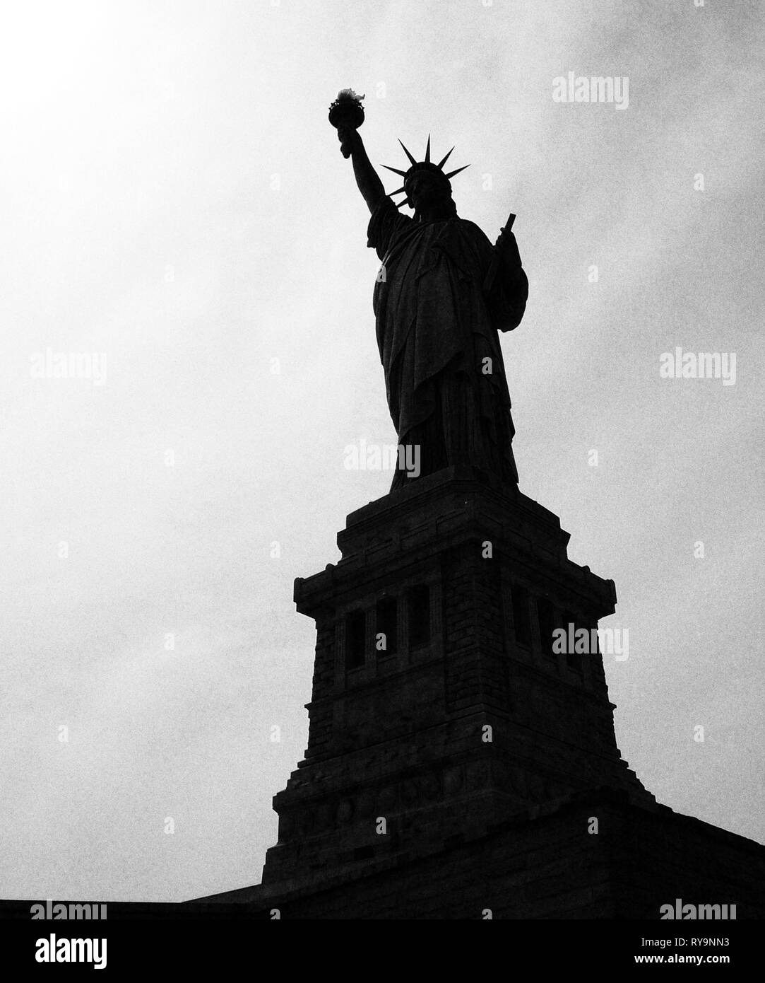 Silhouette of the Statue of Liberty Stock Photo