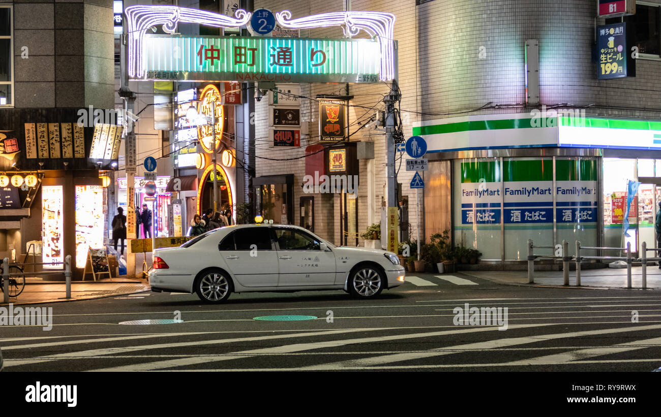TOKYO, JAPAN - FEBRUARY 7, 2019: People in Nakacho,  Ueno, a red-light district with many clubs and hostess bars. Stock Photo