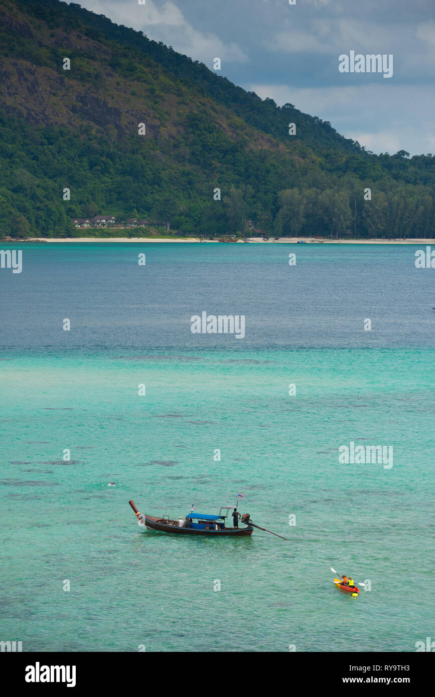 Longtail boat and kayak on Ko Lipe beach, Thailand Stock Photo
