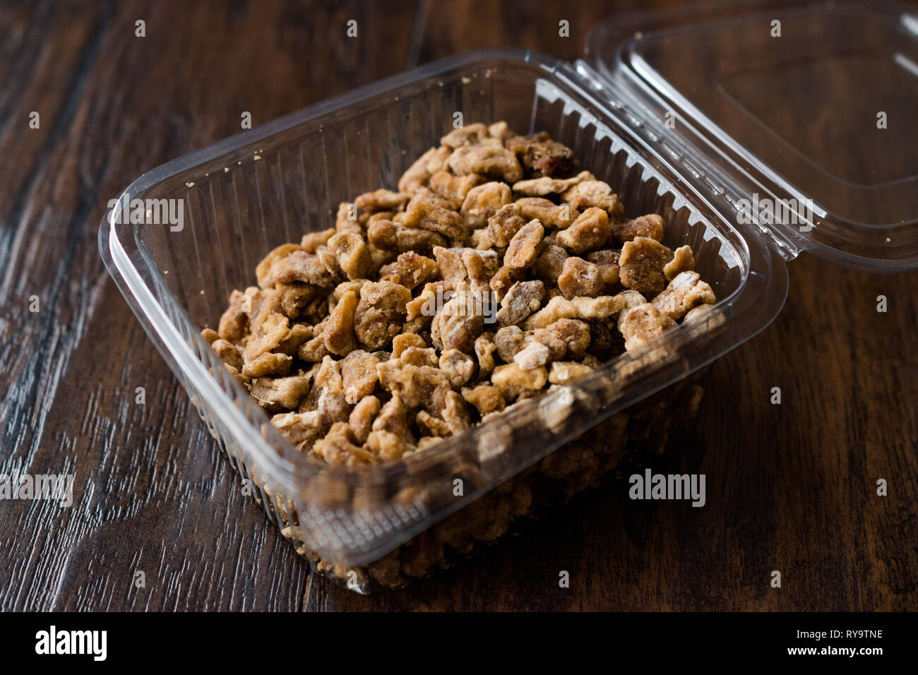 Dried Date Fruit Pieces in Plastic Box Container / Package Healhty Snacks. Stock Photo