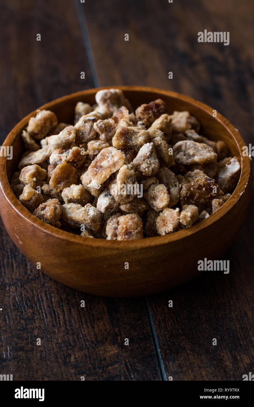 Dried Date Fruit Pieces in Wooden Bowl / Organic Dry Fruit Snacks. Healthy Appetizer. Stock Photo