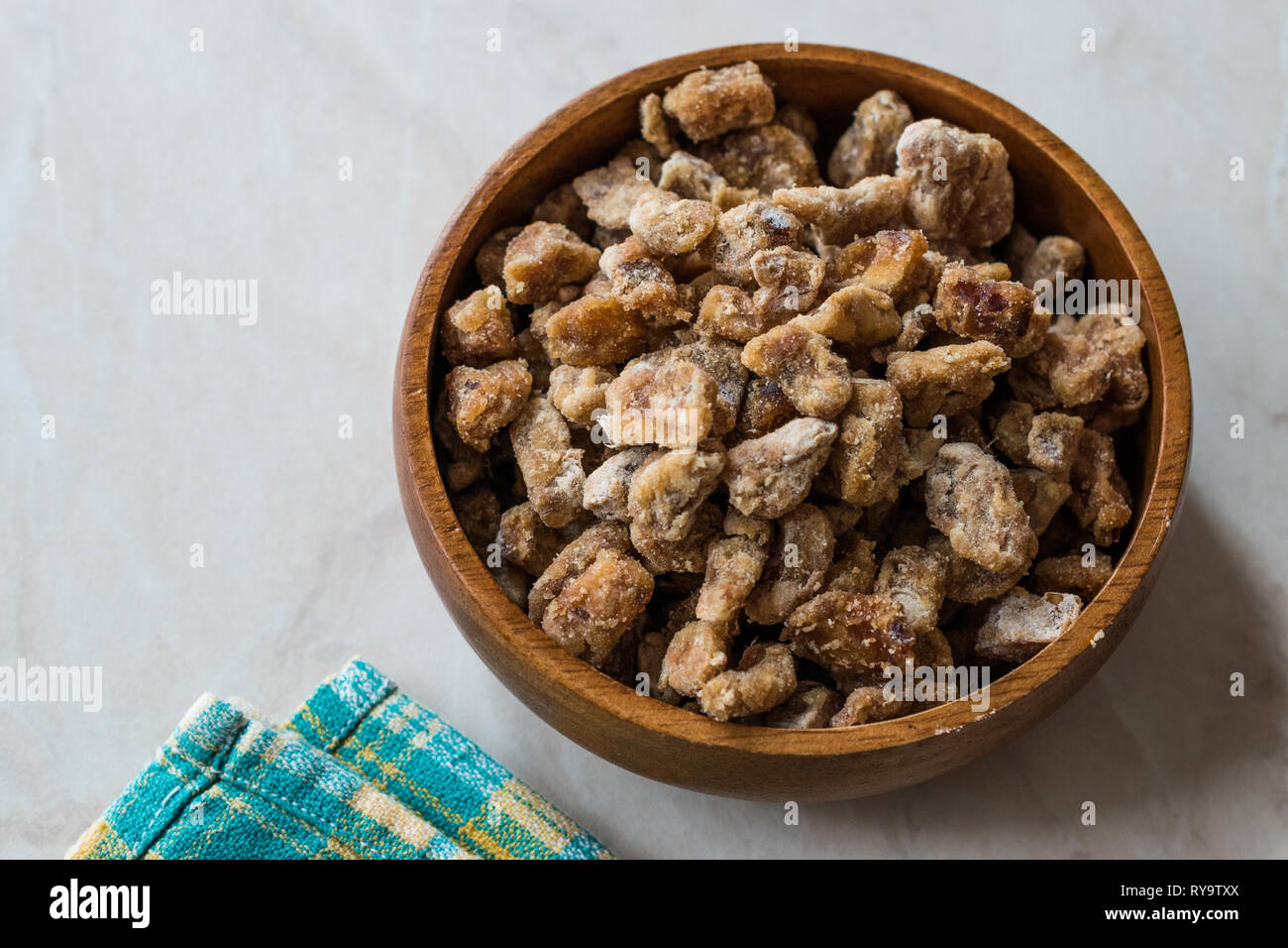 Dried Date Fruit Pieces in Wooden Bowl / Organic Dry Fruit Snacks. Healthy Appetizer. Stock Photo