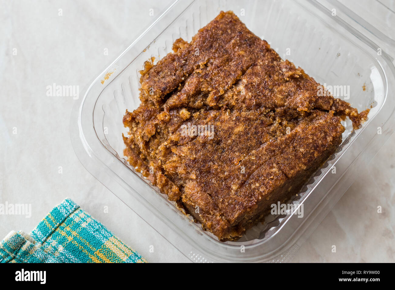 Organic Date Fruit Paste Dough in Plastic Box Container / Package for Breakfast. Stock Photo