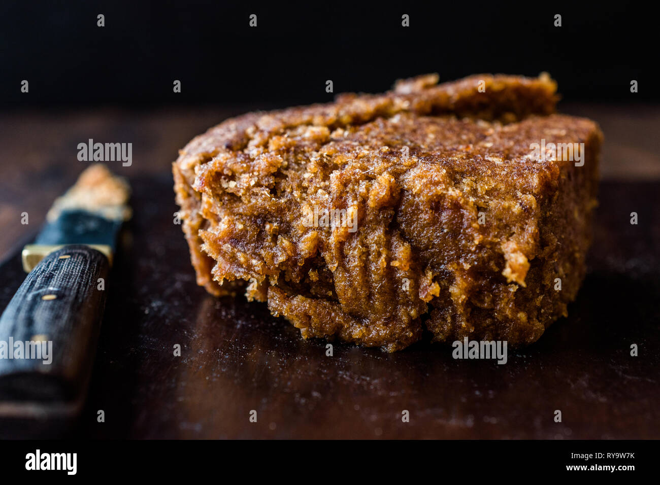 Organic Date Fruit Paste Dough on Dark Wooden Surface for Breakfast. Stock Photo