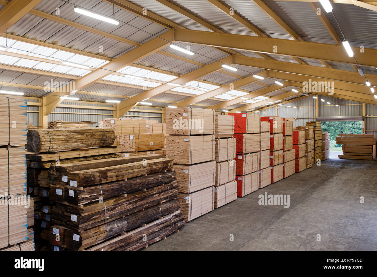 Stacks of lumber in warehouse Stock Photo