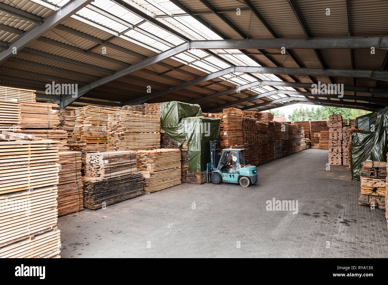 Forklift in lumber warehouse Stock Photo