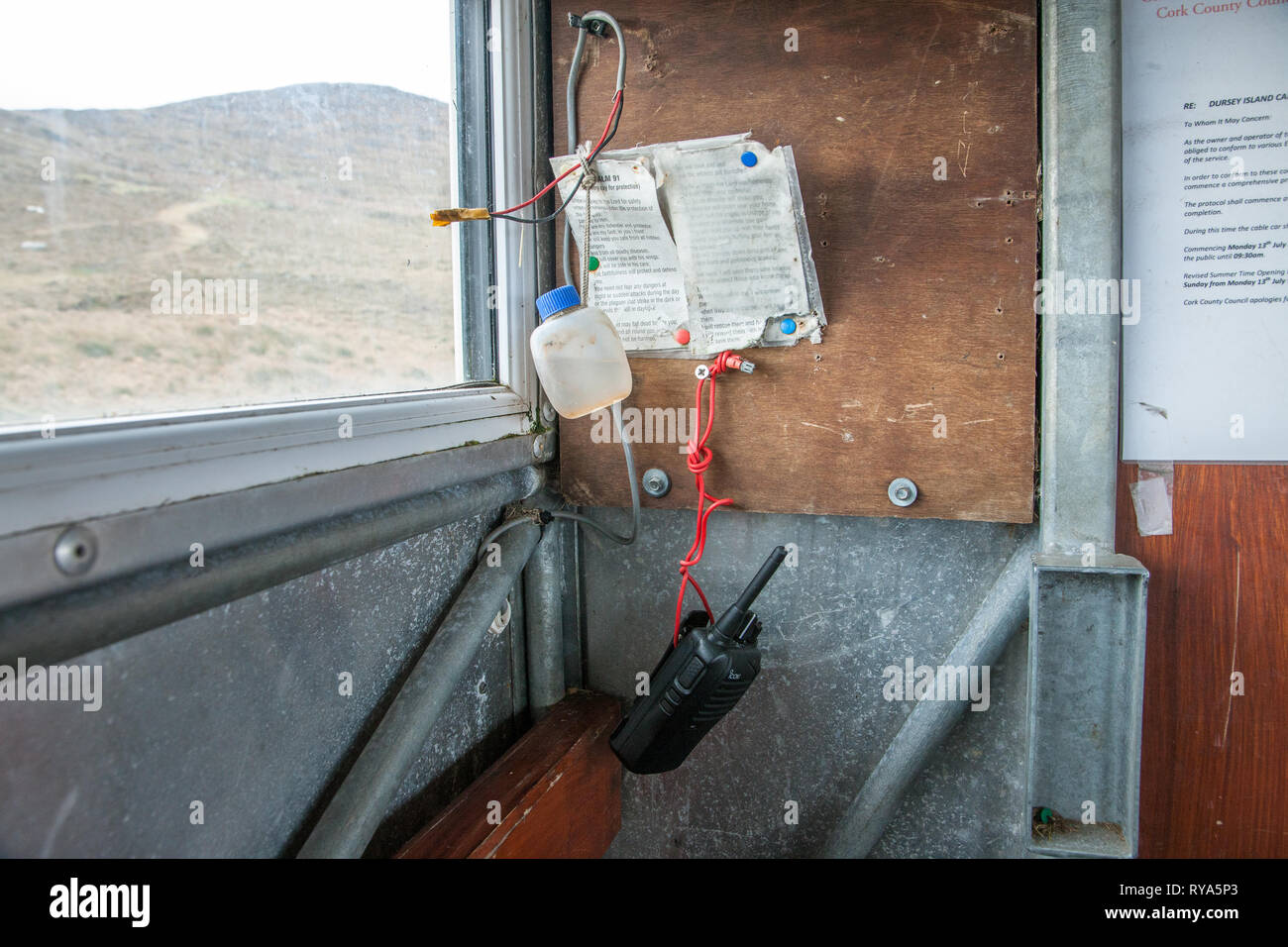 Dursey Island, Cork, Ireland. 26th February, 2016. Interior of the cable car which has a walkie-talkie, a prayer, and holy water for travellers who ma Stock Photo