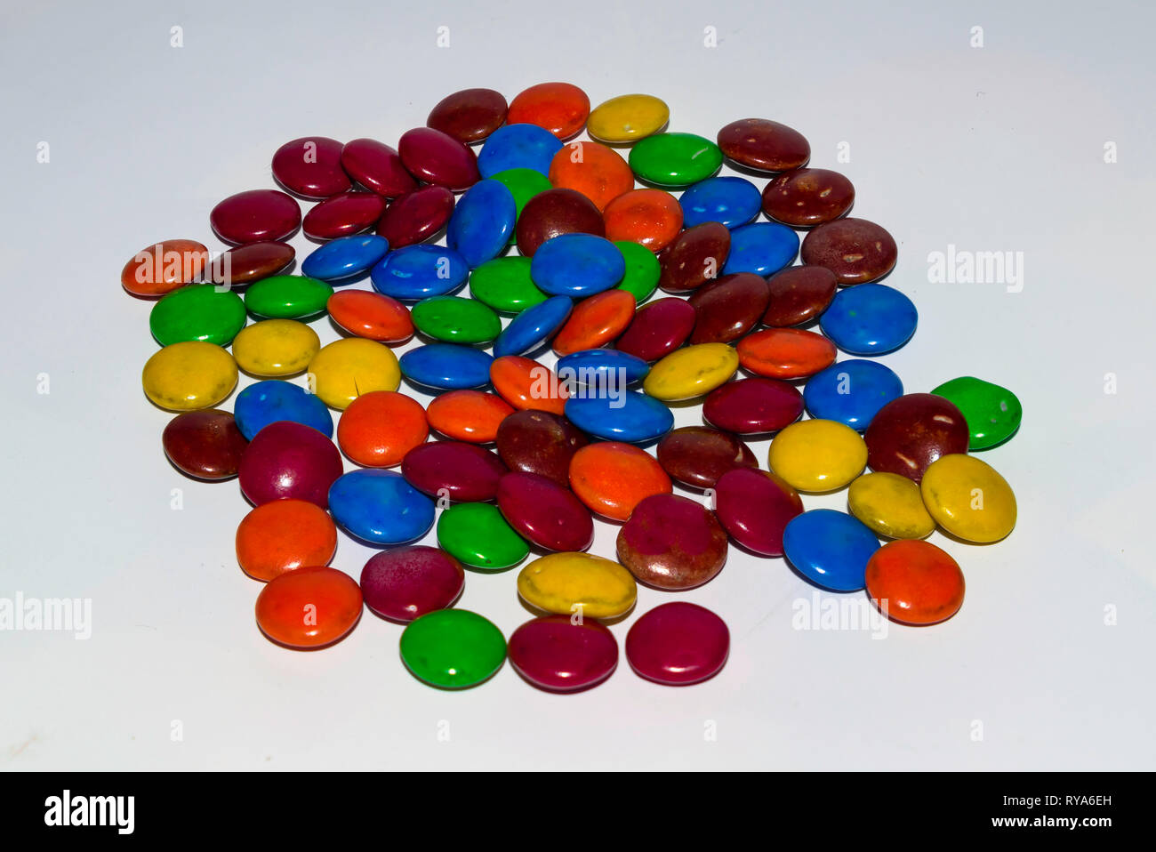colorful coated chocolate candies on a white background Stock Photo - Alamy